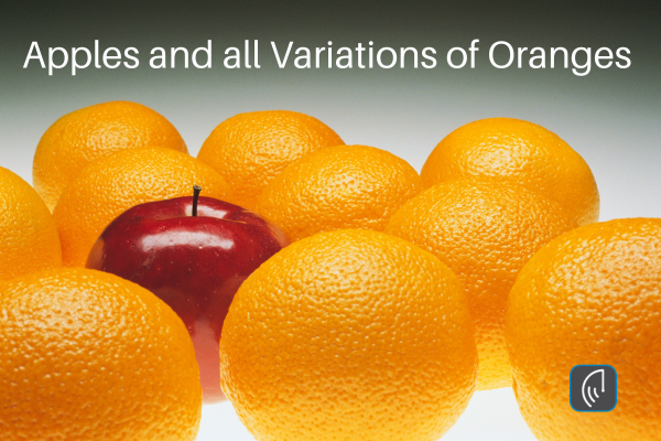 "Header image featuring one red apple in the center, surrounded by several oranges, with the text 'Apples and all Variations of Oranges'."