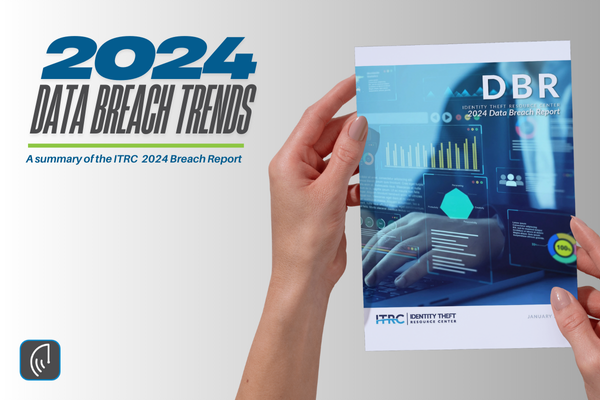 Hands holding the 2024 Data Breach Report by the Identity Theft Resource Center (ITRC), featuring a cover with cybersecurity graphics and data visualizations.